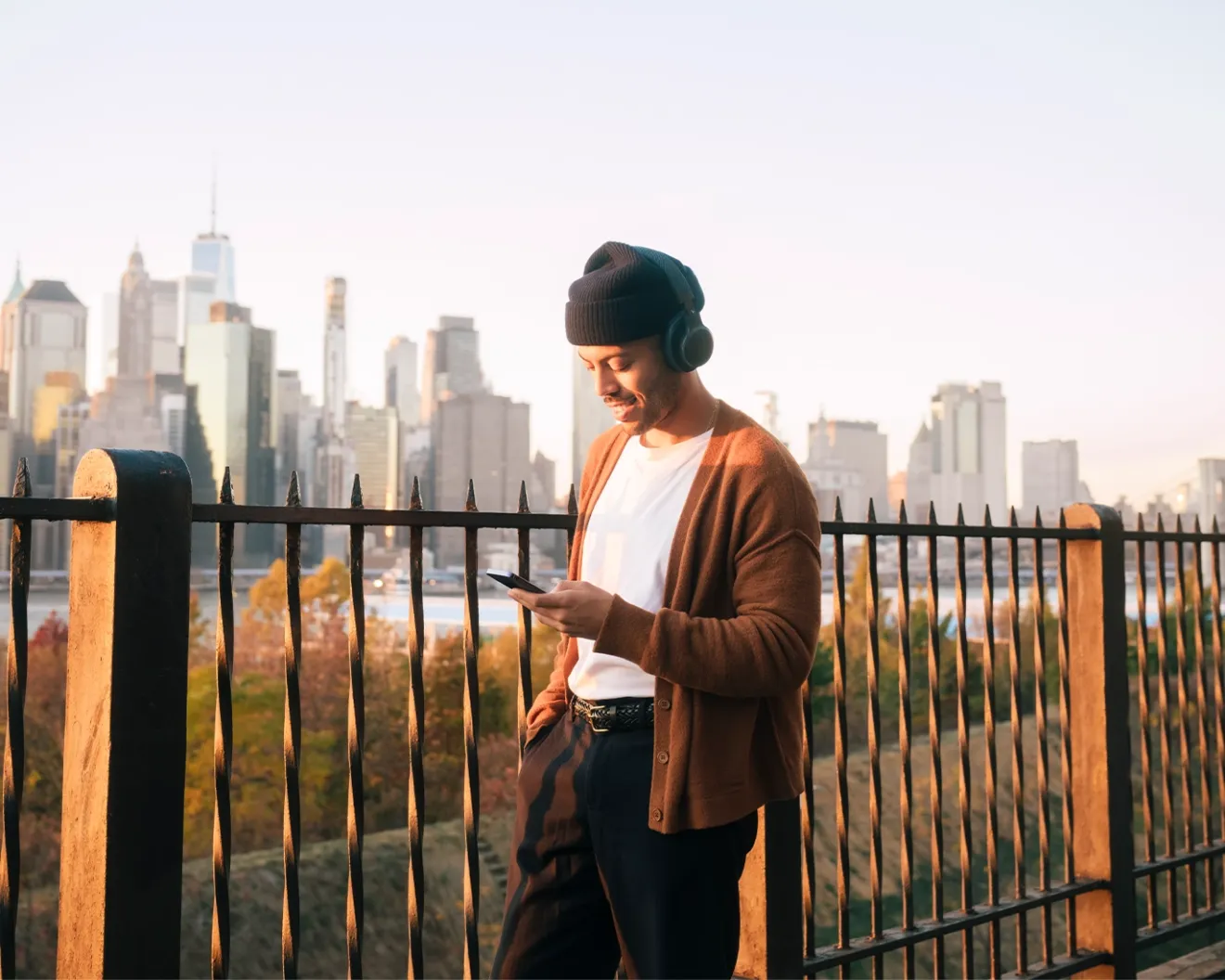 Person standing near viewpoint using mobile phone